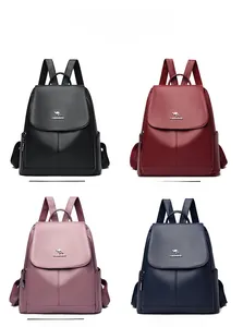 Detail view of lychee texture leather backpacks in four colors with kangaroo metal logo