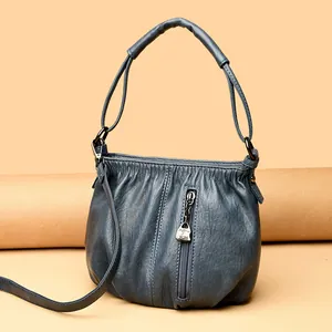 Premium soft leather shoulder bucket bag for women in elegant fog blue with metal pendant