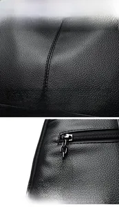 Close-up of black litchi grain leather texture and silver metal kangaroo logo zipper