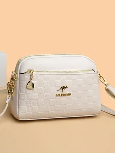 Chic beige leather crossbody bag for women featuring embossed checkerboard pattern and gold hardware