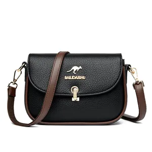 Women's black lychee leather crossbody bag with brown strap and gold kangaroo logo