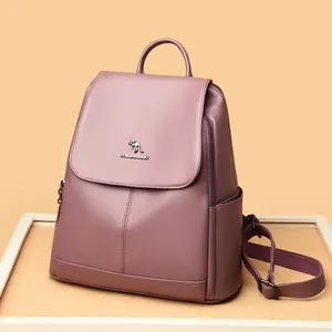 Chic dark pink leather backpack for women with textured finish and kangaroo logo