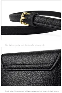 Detail of lychee pattern leather texture with adjustable strap and golden metal buckle