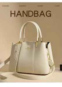Detail of cream leather handbag with gold kangaroo logo and adjustable shoulder strap
