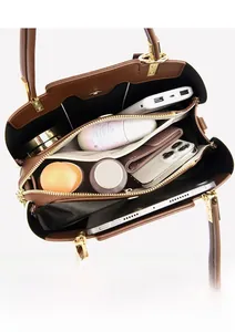 Top view of brown leather handbag interior with multi-layer pockets and large capacity