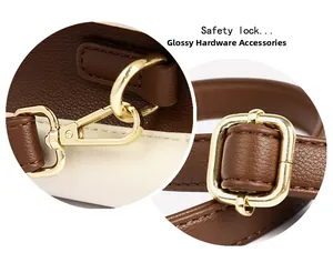 Detailed close-up of glossy gold-tone hardware and buckle on a leather handbag