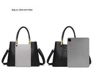 Size comparison of black leather handbag with iPad mini and standard iPad