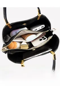 Interior view of leather handbag showing multiple compartments and large storage capacity