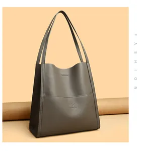 Close-up of elephant gray pebble leather tote bag with embossed kangaroo logo detail
