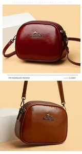 Close-up of triple zipper structure and leather texture on burgundy and brown crossbody bags