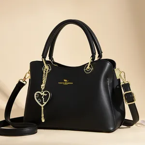 Elegante schwarze Lederhandtasche mit Känguru-Logo und goldfarbenen Details für Damen