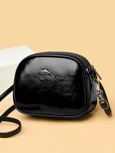 Black oily leather crossbody bag with three zipper layers and adjustable shoulder strap