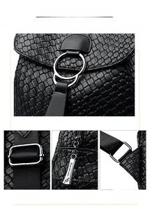 Detail of black woven texture leather and shiny silver hardware on a large backpack