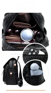 Detail view of woven texture black backpack featuring secure anti-theft back zipper pocket