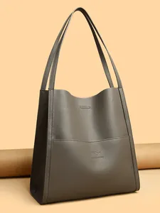 Elegant grey pebble leather tote bag with kangaroo logo and slim shoulder straps