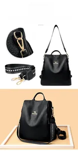 Detail of black lychee texture backpack with wide geometric strap and gold-tone hooks