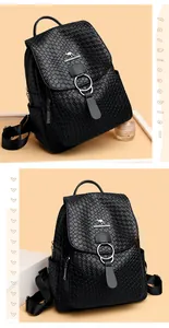 Detailed view of black kangaroo textured leather backpack with silver ring buckle