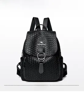 Detailed view of black soft leather backpack featuring elegant woven texture and metal ring
