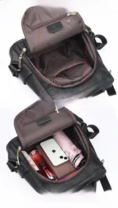 Internal view of the black backpack showing the large capacity and multiple pockets