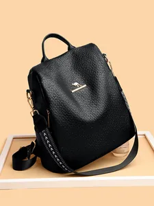 Fashionable black leather backpack for women with kangaroo logo and floral strap