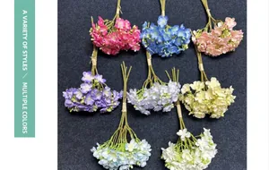 Macro view of artificial jasmine bouquet in multiple colors for home decoration