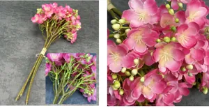 Detailed view of artificial pink jasmine bouquet with realistic petals and green stems