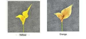 Detail view of lifelike yellow and orange EVA calla lilies with realistic textures