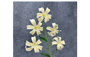 Detail of 5-head artificial lily with creamy white petals and natural orange spots