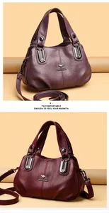 Detail view of leather bags in purple and burgundy with silver kangaroo metal logo