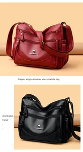 Detail of lychee pattern leather bags with golden kangaroo logo and multi-zipper layers