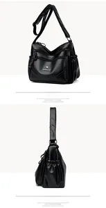 Close-up of black litchi grain leather bag showing multiple zippers and logo detail