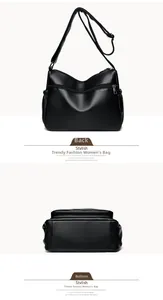 Detail view of black lychee leather bag with adjustable strap and bottom perspective