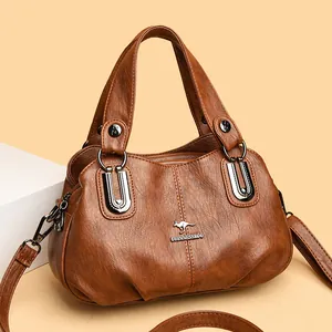 Brown leather handbag for women with dual handles and adjustable shoulder strap