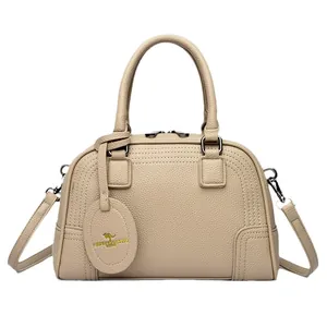 Chic beige lychee textured Boston handbag with detachable shoulder strap and metal zippers