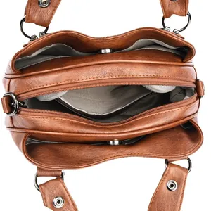 Brown leather handbag with multi-compartment interior and silver zipper details