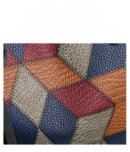 Detailed macro view of stitched diamond pattern and lychee texture on the tote bag