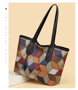 Close-up of geometric 3D color-block tote bag with premium embossed leather texture