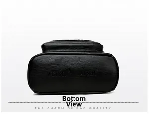 Detailed bottom view of the black leather backpack featuring embossed kangaroo logo and texture