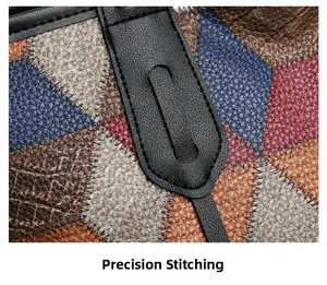 Close-up of precision stitching on a multi-color geometric patchwork leather tote bag