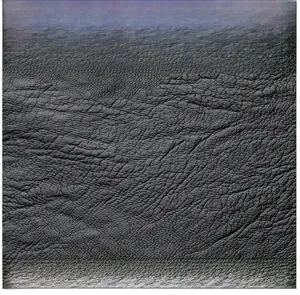 Close-up of premium embossed leather texture on a durable large capacity backpack