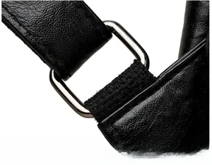 Detail of reinforced shoulder strap buckle on black lychee grain leather backpack