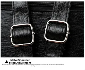 Macro detail of adjustable shoulder straps with silver metal buckles on a black leather bag