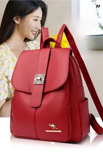 Close-up of red lychee grain leather backpack with golden kangaroo logo and metal lock
