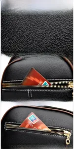 Close-up of black lychee grain leather bag featuring functional gold zipper pockets