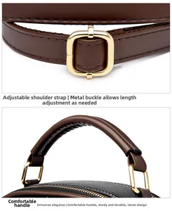 Detail of lychee pattern leather body with golden buckle and brown adjustable strap