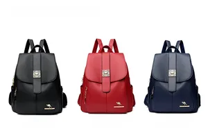 Close-up of leather backpack hardware featuring a square metal clasp and golden kangaroo logo