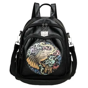 Black leather backpack for women with colorful elephant embossing and adjustable straps