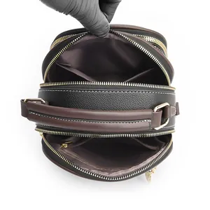 Three-compartment black and brown lychee grain leather crossbody bag for women