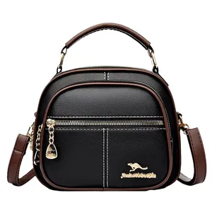 Chic black lychee leather round bag with contrast brown straps and kangaroo logo