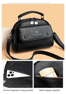 Detail view of the black textured leather bag showing front magnetic snap and rear zip pockets